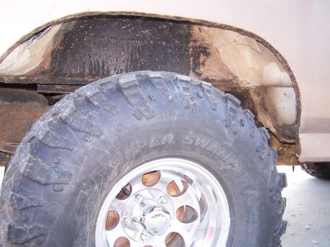 1981 Ford Bronco - Detail shot of a vehicle's wheel well and a Super Swamper tire.