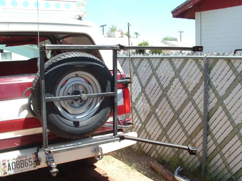 1990 Ford Bronco - The rear of a 1990 Ford Bronco features a spare tire carrier with a mounted spare tire.