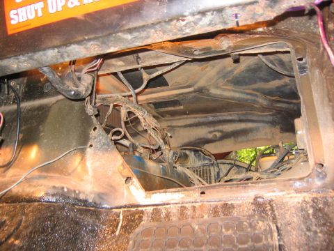 1979 Ford Bronco - Close-up view of the engine bay wiring and radiator, with a partial orange sticker visible.