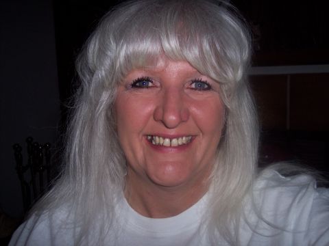 1972 Ford Ranchero - A woman smiles for the camera, her long gray hair framing her face.