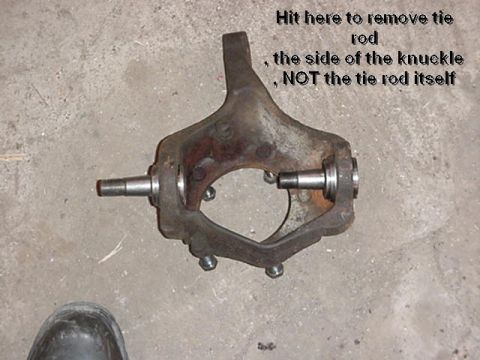 1992 Ford Bronco - A steering knuckle part is shown with instructions on how to remove a tie rod.