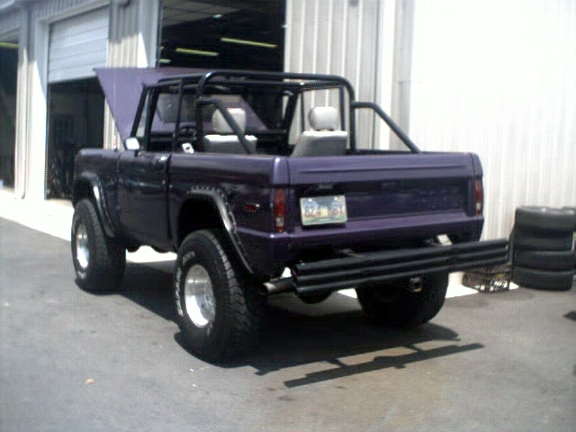 Purple 1978 Ford Bronco rear view with roll cage and aftermarket bumper