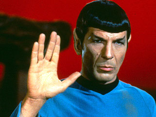 1991 Ford Probe - A character from Star Trek, identified as Spock, is depicted with a red background and a watermark.