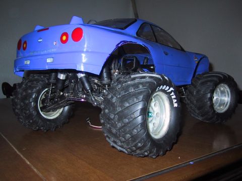 1990 Ford Bronco - This RC monster truck features a modified body and oversized tires, not a 1990 Ford Bronco.