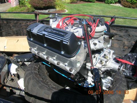 1996 Ford Bronco - A Ford Racing engine is shown, likely a performance upgrade, with visible spark plug wires and a distributor cap.