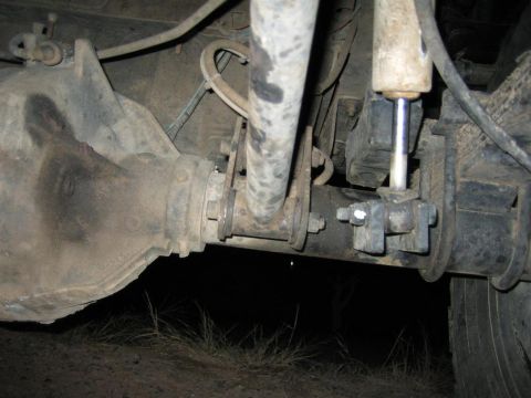 1994 Ford Bronco - Close-up view of rear axle and suspension parts, likely from an older SUV or truck.