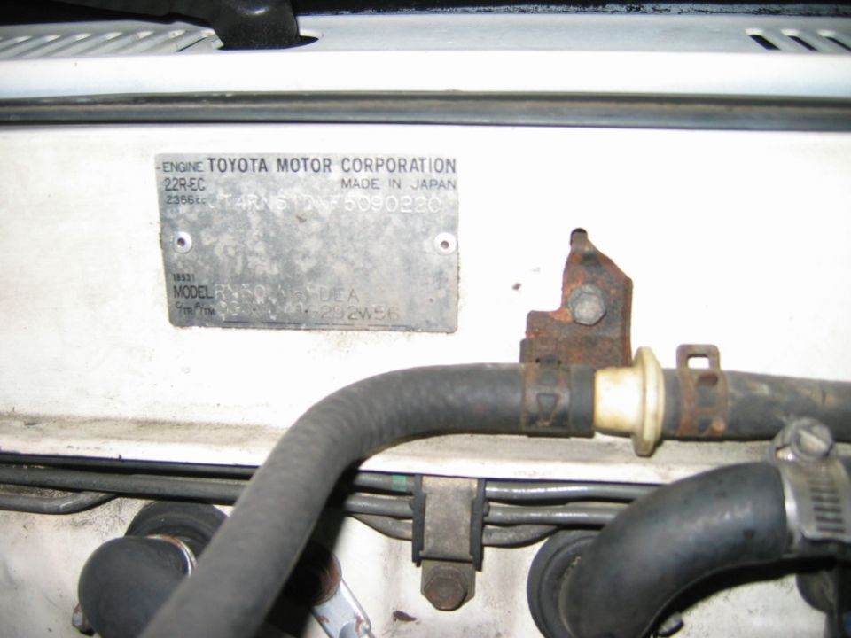 Toyota Motor Corporation ID plate on the firewall listing the 22R-EC engine and 2366cc displacement
