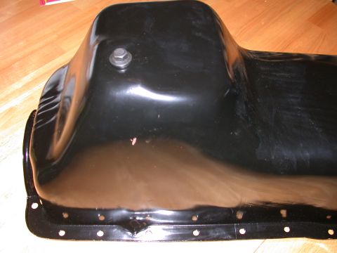 1995 Ford Bronco - Close-up of a black oil pan, likely a replacement part.