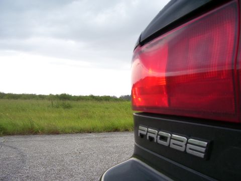 1994 Ford Probe - Close-up of the rear taillight and PROBE badge on a 1994 Ford Probe.