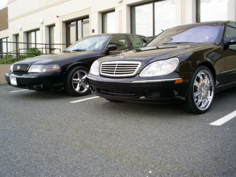 2003 Mercury Marauder - Two black sedans, a Mercury Marauder and a Mercedes-Benz S-Class, are parked side-by-side in a lot.