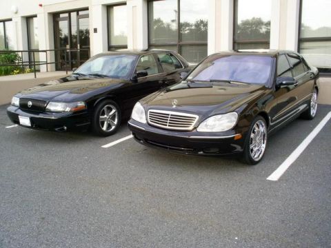 2003 Mercury Marauder - A black 2003 Mercury Marauder is parked in a lot next to a Mercedes-Benz sedan.