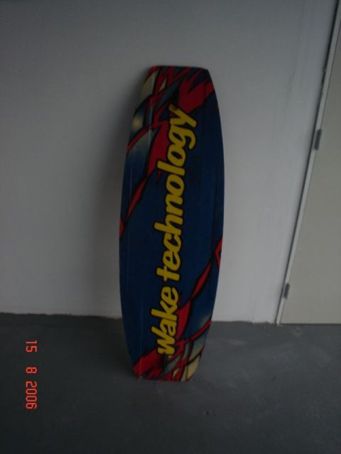 1990 Ford Bronco - Wakeboard with 'wake technology' text leaning against a wall.