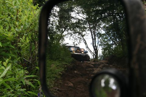 2004 Jeep TJ - A Jeep Wrangler navigates a challenging, rocky off-road path.