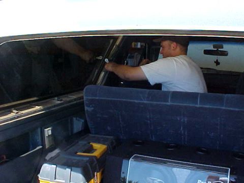 1987 Ford Bronco - A buddy of mine, Dash, helping me take the trim off from the top removal.