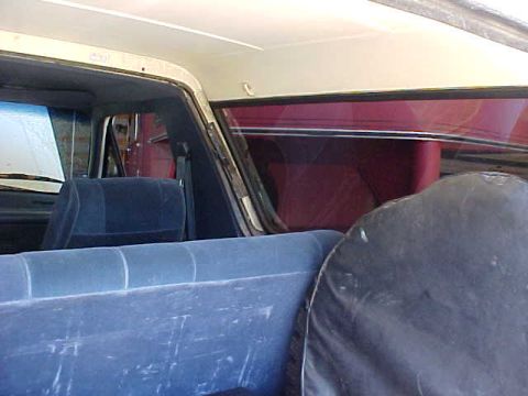 1987 Ford Bronco - The passenger side trim is off ready for the screw removal.