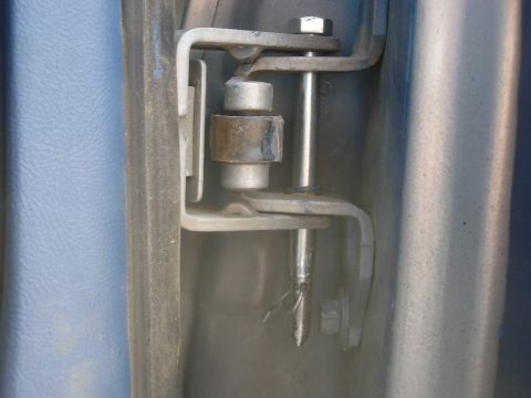 1995 Ford Bronco - Dropped in the hinge with a hole drilled for a cotter pin. They fit very snug, so the pin's not really necassary.