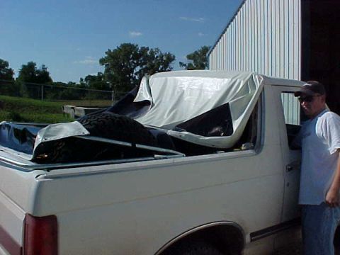 1987 Ford Bronco - At 3:30 PM, we had all the rails screwed on, and were starting to drill the holes for the snaps. I'm glad Dash was there to help. This is d…