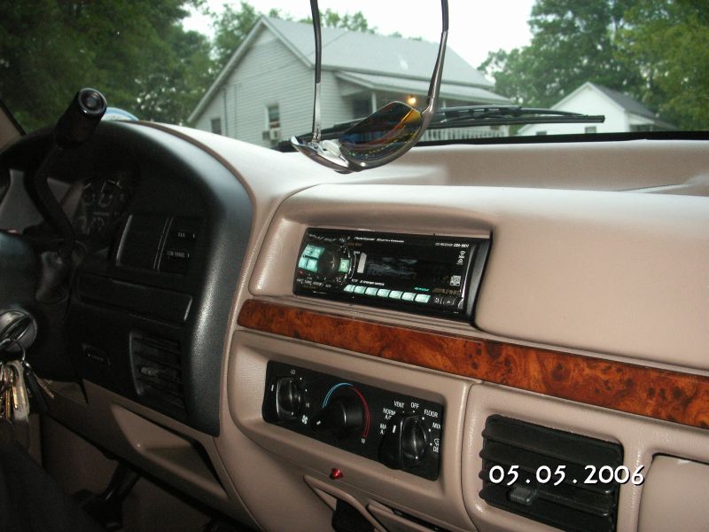 1996 Ford Bronco interior dashboard with aftermarket stereo and wood trim