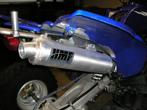 1993 Ford Bronco - Close-up view of an HMF Performance exhaust system on a blue ATV.