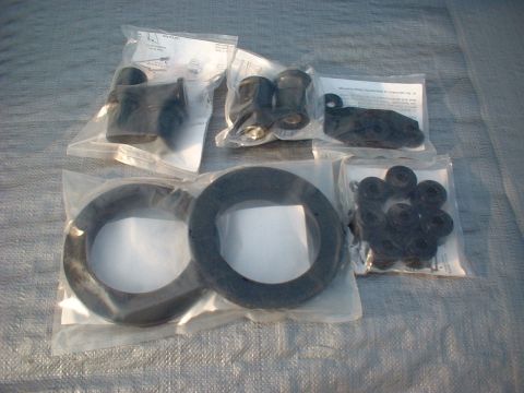 1969 Ford Mustang - Various automotive rubber parts are packaged and displayed on a grey tarp, with a watermark at the bottom right.