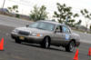 2001 Mercury Grand Marquis - A 2001 Mercury Grand Marquis navigates a course marked by traffic cones.