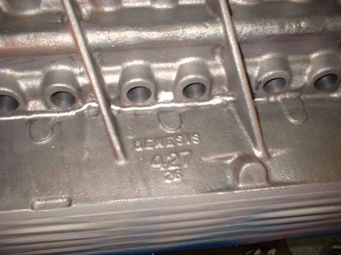 1967 Ford Fairlane - Close-up of an engine block casting showing "GENESIS 427" and "26" stamped into the metal.