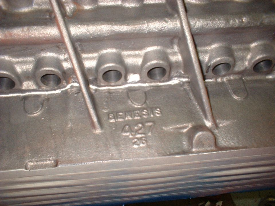 Engine block casting with "GENESIS 427" stamped on it
