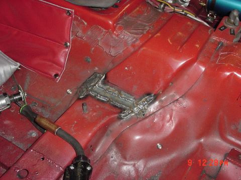 1993 Ford Mustang - Welding repair on the interior floor pan of a vehicle.