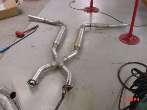 1993 Ford Mustang - Custom exhaust system with X-pipe configuration, likely for a performance application.