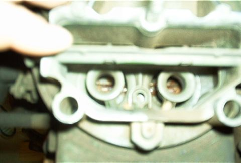 1986 Ford Bronco - Carburetor intake ports are visible in this close-up shot.