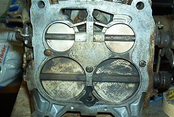 Carburetor with four throttle plates, two open and two closed