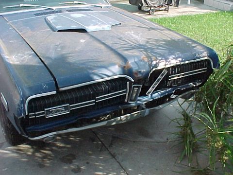 1968 Mercury Cougar - The hood was dented right in the center and the driver side grille was busted. Fortunately the GT-E grille bars were all there and restorab…