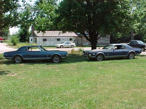 1968 Mercury Cougar - At my new house. The car on the left is a low mileage original that had been in a barn for almost 25 years. I had it at my house for a few…