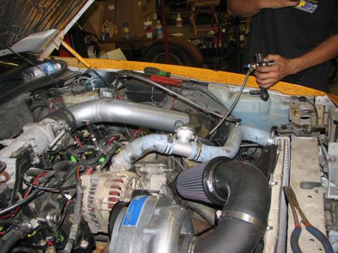 2001 Mercury Grand Marquis - Custom engine modifications are visible in this engine bay, with a person attending to the components.
