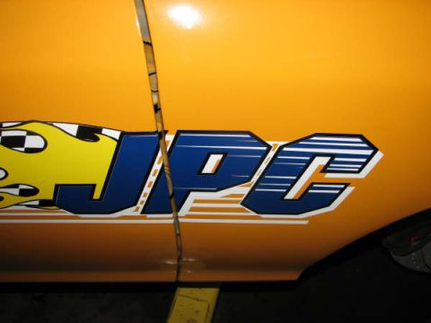 2001 Mercury Grand Marquis - A close-up of a vehicle door shows a custom decal with the letters JPC and flame graphics.