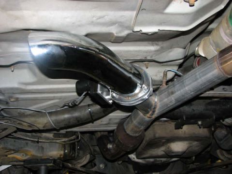 2001 Mercury Grand Marquis - Close-up of the exhaust system components underneath a vehicle.