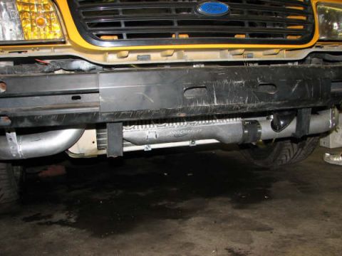 2001 Mercury Grand Marquis - Yellow Ford Crown Victoria front end with a ProCharger supercharger visible.
