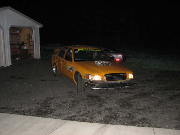 Yellow 2001 Mercury Grand Marquis taxi with hood scoop