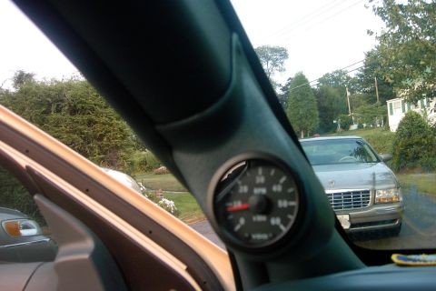 1996 Mercury Grand Marquis - A VDO tachometer is installed in a custom gauge pod inside a vehicle.