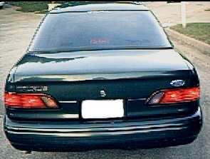 1994 Ford Taurus - Rear view of a 1994 Ford Taurus sedan parked outdoors.
