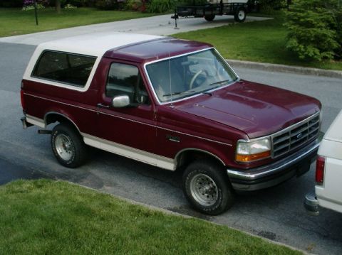 1992 Ford Bronco - This 1992 Ford Bronco is a two-tone maroon and white SUV with a removable hardtop.
