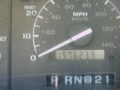1992 Ford Bronco - Close-up of a vehicle's dashboard gauges, including the odometer and gear selector.