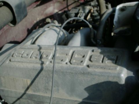 1992 Ford Bronco - Close-up of an engine valve cover displaying '5.0 EFI' text.