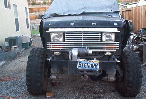 1986 Ford Bronco - This lifted 1986 Ford Bronco features a prominent grille, a winch, and a custom Nevada license plate.