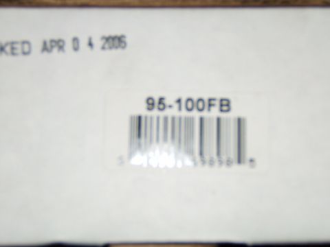 1988 Ford Bronco - A close-up of a label shows a packing date and a part number with a barcode.