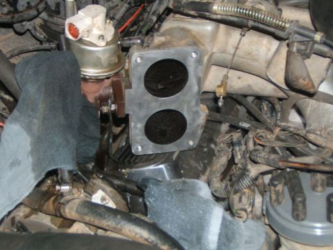 1988 Ford Bronco - Close-up view of engine components, including an intake manifold and associated wiring.