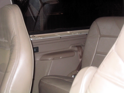 1996 Ford Bronco - Interior view of a 1996 Ford Bronco, showing tan leather seats and door panels.