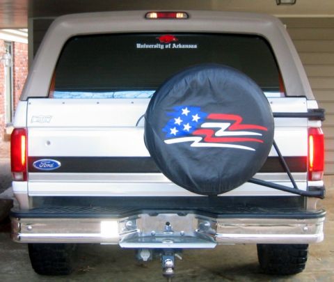 1996 Ford Bronco - The rear of a 1996 Ford Bronco is shown, complete with a spare tire cover and a University of Arkansas decal on the window.