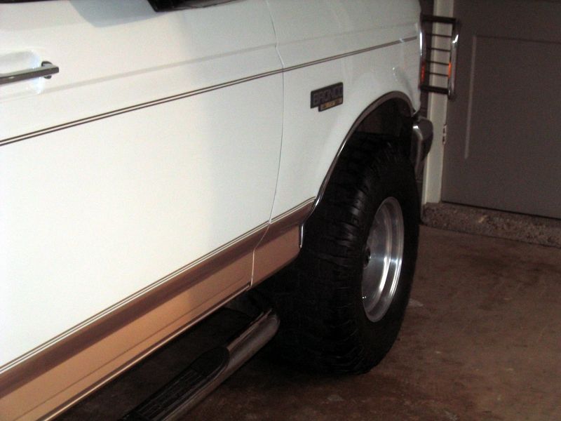 1996 Ford Bronco side view showing fender, wheel, and running board