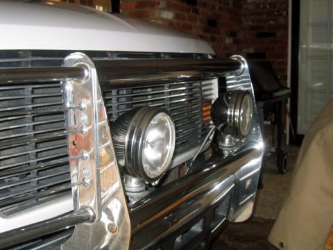1996 Ford Bronco - Vehicle front end detail showing grille, bumper, and added lights.